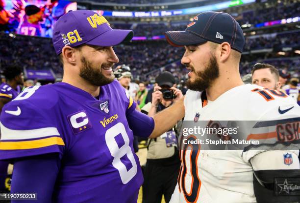 Mitchell Trubisky of the Chicago Bears greets Kirk Cousins of the Minnesota Vikings after the game at U.S. Bank Stadium on December 29, 2019 in...
