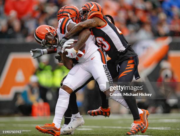 Jarvis Landry of the Cleveland Browns breaks away from the tackle of B.W. Webb of the Cincinnati Bengals and would go on to score a touchdown during...