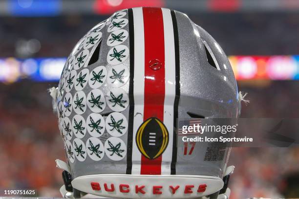An Ohio State Buckeyes helmet with the college football playoff logo during the Fiesta Bowl college football playoff semi final game between the...