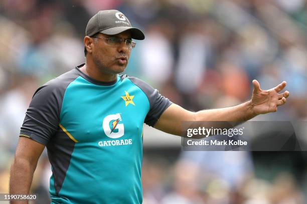 Pakistan coach Waqar Younis speaks to Mohammad Abbas of Pakistan on the boundary during play on day one of the 2nd Domain Test between Australia and...