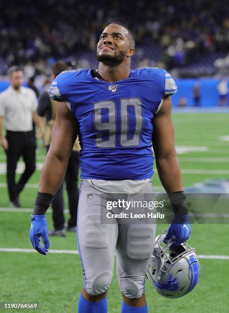 Trey Flowers of the Detroit Lions walks of the field after the Green Bay Packers kicked the game winning field goal during the game at Ford Field on...