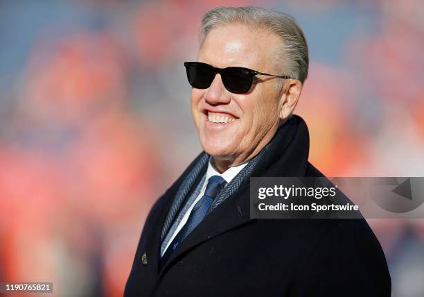 Denver Broncos General Manager John Elway stands on the field prior to a regular season game between the Denver Broncos and the visiting Oakland...