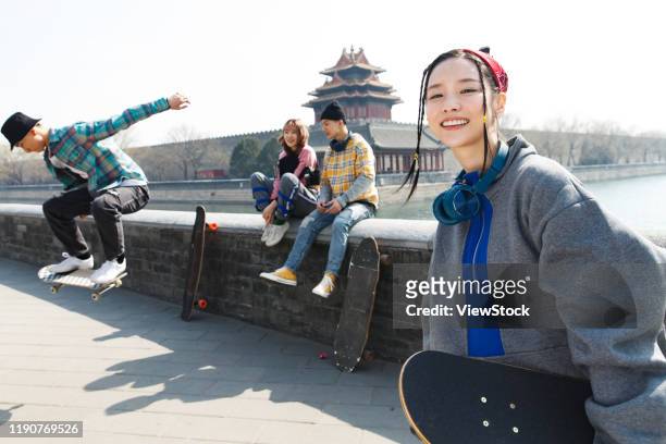 young people skateboarding - couple skating stock pictures, royalty-free photos & images
