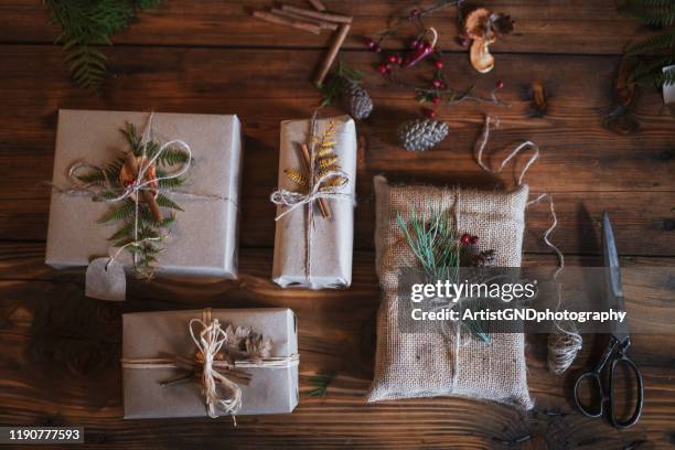 preparing christmas gifts. - gift bag stock pictures, royalty-free photos & images