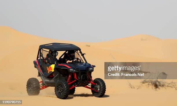 Max Verstappen of Netherlands and Red Bull Racing and Alexander Albon of Thailand and Red Bull Racing take part in the Red Bull Desert Racing at...