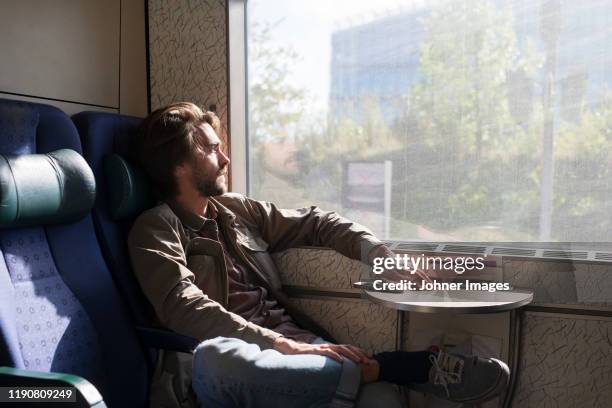 man in train - train denmark stock pictures, royalty-free photos & images
