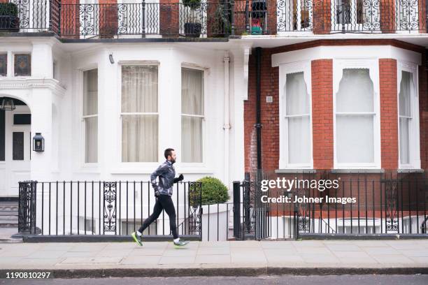 jogger running - london pavement stock pictures, royalty-free photos & images