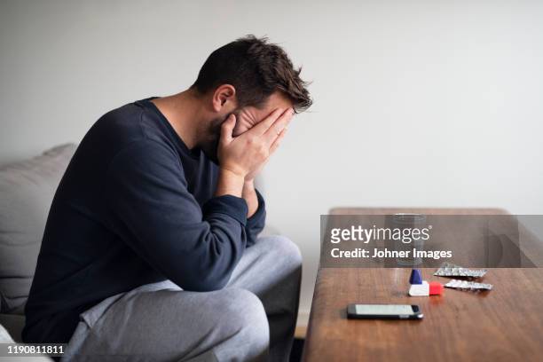 man sitting at a table filled with drugs - last day bildbanksfoton och bilder
