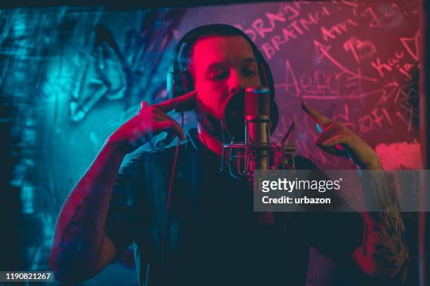 rap musician in studio - pop musician stock pictures, royalty-free photos & images