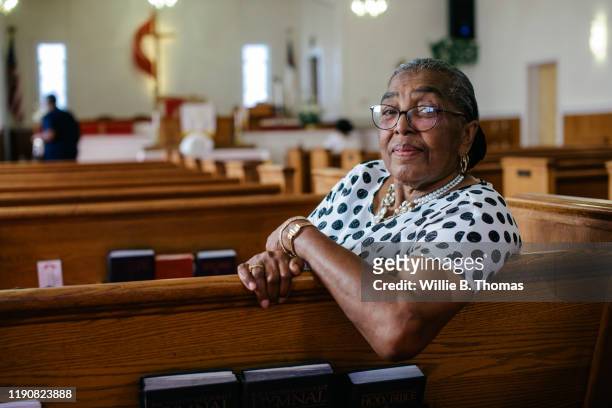 Portrait of senior black woman sitting in Church"n
