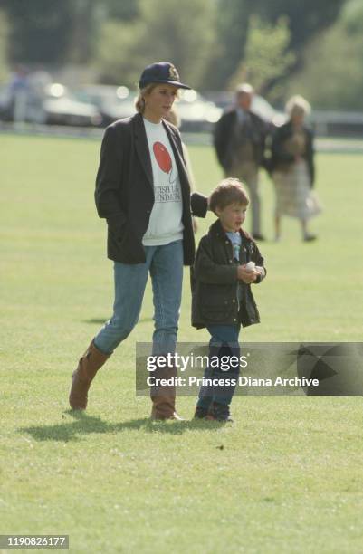 Diana, Princess of Wales with Prince William at the Guards Polo Club in Windsor, 2nd May 1988. She is wearing a British Lung Foundation sweatshirt.