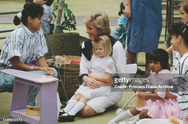 Diana, Princess of Wales at a Dr Barnardo's Home in Auburn, New South Wales, Australia, January 1988. She is wearing a dress by Catherine Walker.
