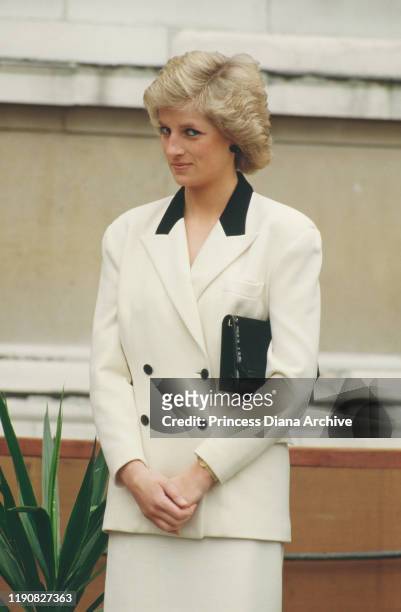 Diana, Princess of Wales lays the foundation stone of the new Sainsbury Wing at the National Gallery in London, 30th March 1988. She is wearing a...