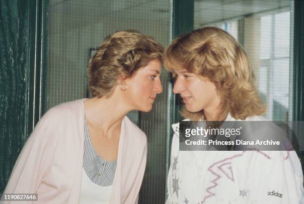 Diana, Princess of Wales poses with German tennis player Steffi Graf after opening the Women's International Tennis Association European Office at...