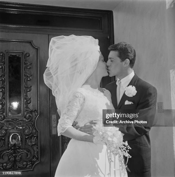 American actor and singer Frankie Avalon with his bride Kathryn 'Kay' Diebel after their wedding in North Hollywood, California, 19th January 1963.