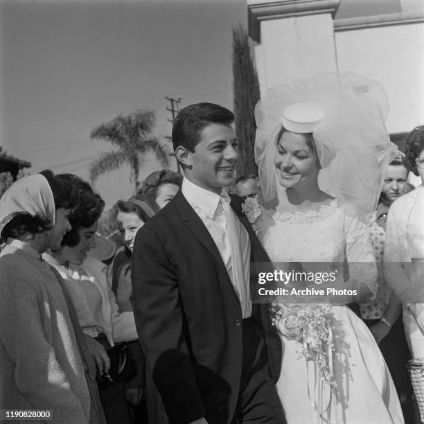 American actor and singer Frankie Avalon with his bride Kathryn 'Kay' Diebel after their wedding in North Hollywood, California, 19th January 1963.