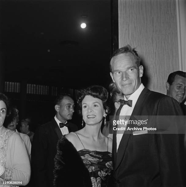 American actor Charlton Heston and his wife, photographer Lydia Clarke at the Hope Dinner, a celebrity charity dinner, USA, circa 1963.