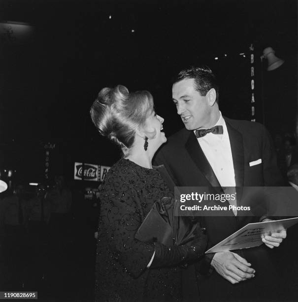 American actor Rock Hudson with actress Marilyn Maxwell at the premiere of the film 'The Ugly American', USA, 1963.