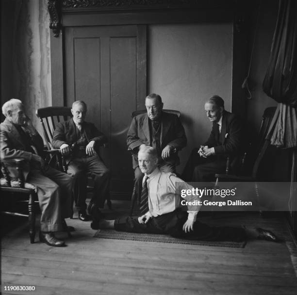 An elderly man doing the splits at a home for retired variety artists in the UK, November 1940.