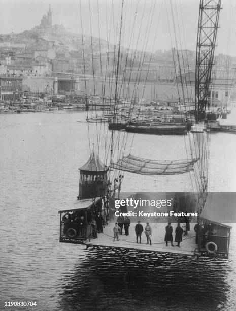 The Marseille Transporter Bridge in the Old Port of Marseille, France, circa 1930. Designed by engineer Ferdinand Arnodin, it was destroyed in 1944...