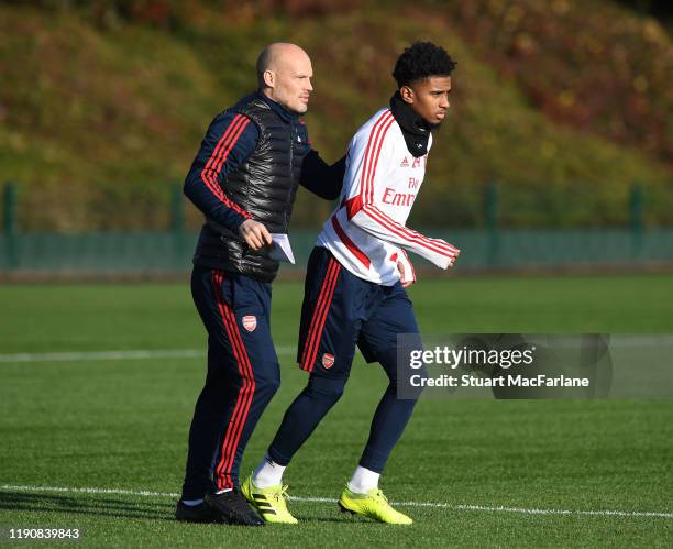 Arsenal Interim Head Coach Freddie Ljungberg with Reiss Nelson during a training session at London Colney on November 29, 2019 in St Albans, England.