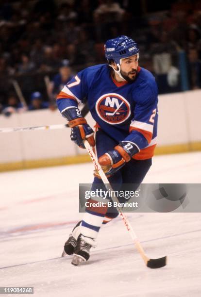 John Tonelli of the New York Islanders skates with the puck during an NHL game circa 1979.