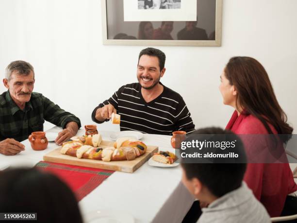 happy mexican family eating traditional rosca de reyes - epiphany stock pictures, royalty-free photos & images