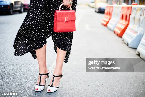 polkadot street fashion - designer bag stock pictures, royalty-free photos & images