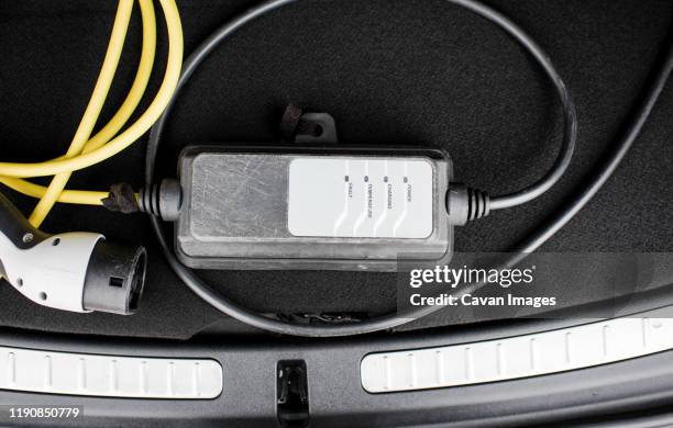 electric car lead in the trunk of a car - car electro stock pictures, royalty-free photos & images