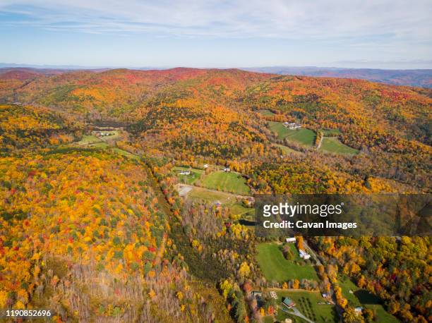 fall foliage seen from the air near quechee, vermont. - woodstock and aerial stock pictures, royalty-free photos & images