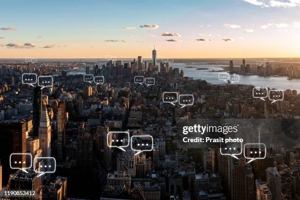 bubble chat for communication for text on manhattan skyline in new york city and sky background with bubble chat ,business analysis and strategy as concept - news foto e immagini stock