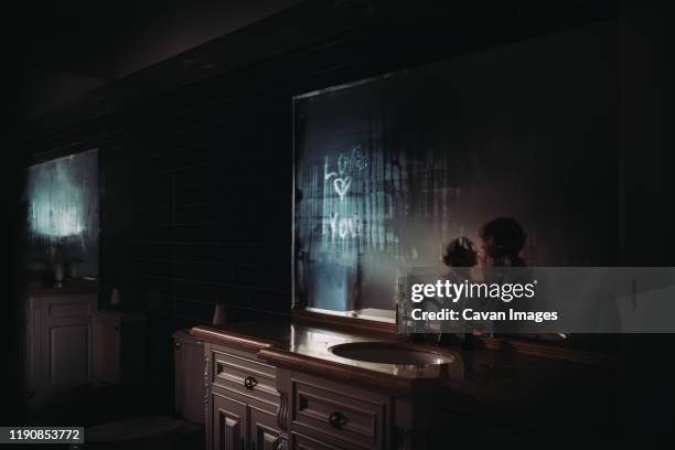 mother and daughter in bathroom - nursery night stock pictures, royalty-free photos & images