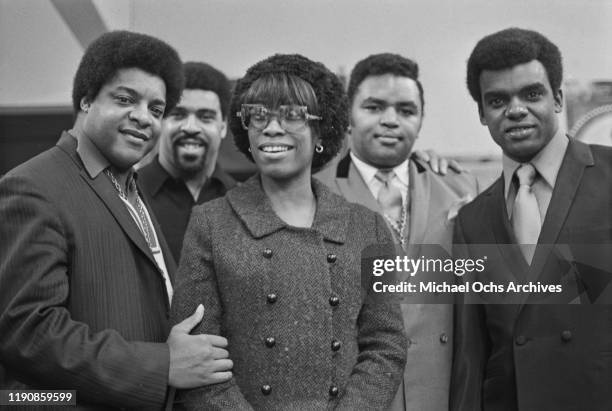 American preacher and singer Solomon Burke at the offices of 'R'n'B World' magazine in New York City, USA, with vocal trio the Isley Brothers, and...