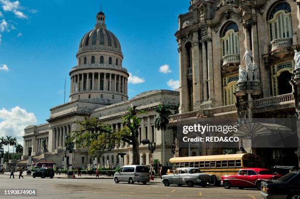 Vintage cars and old Capitolio building in Havana town. Cuba.