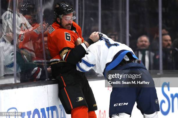 Erik Gudbranson of the Anaheim Ducks fights with Anthony Bitetto of the Winnipeg Jets during the first period of a game at Honda Center on November...