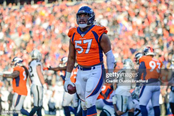 DeMarcus Walker of the Denver Broncos celebrates after a turnover on downs in the second quarter of a game against the Oakland Raiders at Empower...