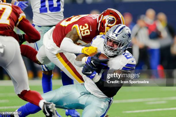 Dallas Cowboys running back Ezekiel Elliott runs through the line of scrimmage and scores a touchdown during the game between the Dallas Cowboys and...