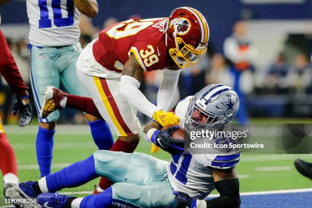 Dallas Cowboys running back Ezekiel Elliott runs through the line of scrimmage and scores a touchdown during the game between the Dallas Cowboys and...