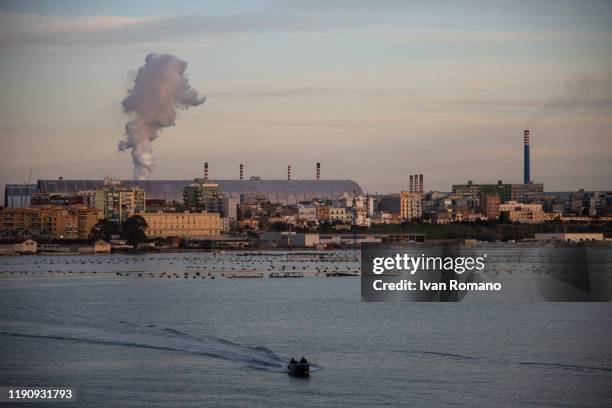 General view of the Arcelormittal plant and the Tamburi district on November 29, 2019 in Taranto, Italy. The former Ilva of Taranto, the largest...