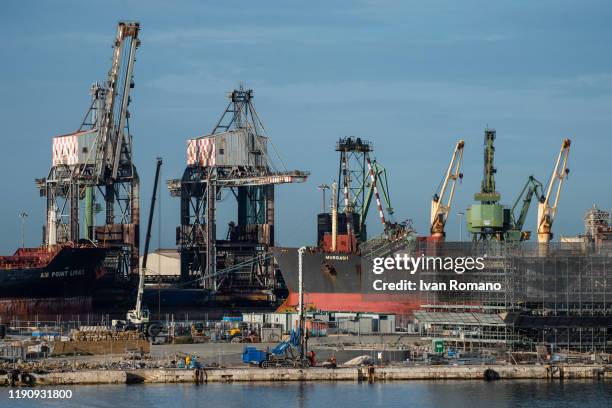 Cranes in the port on November 29, 2019 in Taranto, Italy. The former Ilva of Taranto, the largest steel plant in Europe, was acquired by the Arcelor...