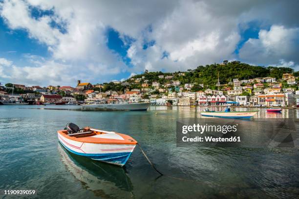 motorboat in harbor of st georges, capital of grenada, caribbean - st george stock-fotos und bilder