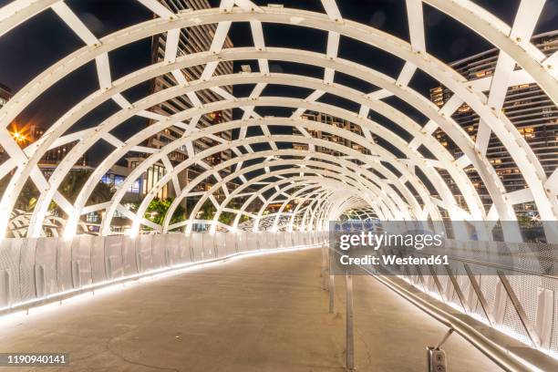 illuminated webb bridge in docklands at night, melbourne, australia - white night melbourne stock pictures, royalty-free photos & images