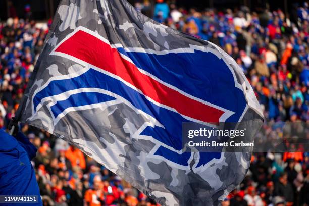 Detail view of Buffalo Bills logo on a camouflage flag waved during the second quarter against the Denver Broncos at New Era Field on November 24,...