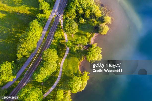 aerial view of railroad tracks by lake schliersee, bavaria, germany - railroad stock-fotos und bilder