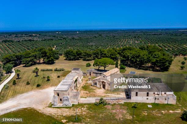 aerial view of santa maria a cerrate and landscape against clear blue sky during sunny day, lecce, italy - cerrate fotografías e imágenes de stock