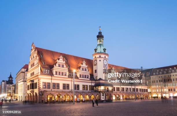 low angle view of town hall tower against clear blue sky in leipzig at dusk, germany - lipsia foto e immagini stock