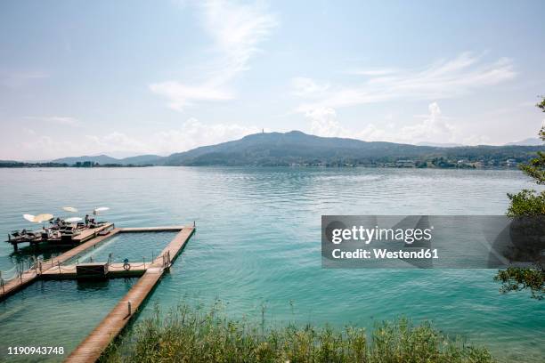 aerial view of woerthersee lake against sky during sunny day, austria - kärnten am wörthersee stock pictures, royalty-free photos & images