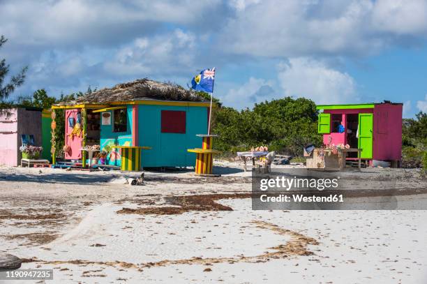 shops at five cays beach against cloudy sky during sunny day, providenciales, turks and caicos islands - turks and caicos islands stock-fotos und bilder