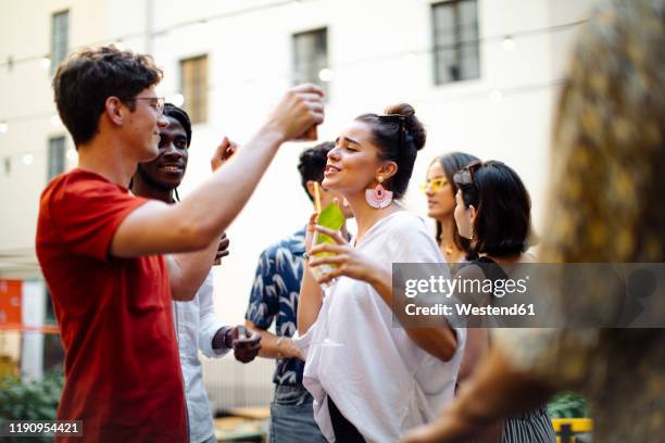 happy multi-ethnic friends having fun during a party - black people cocktail party stockfoto's en -beelden