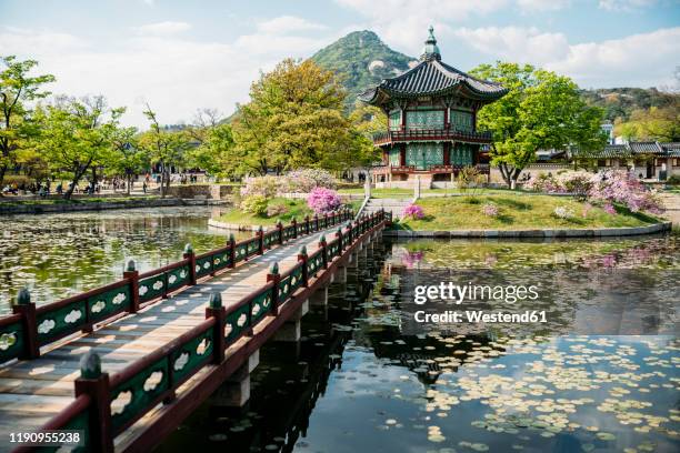 view of pond and pagoda, gyeongbokgung, seoul, south korea - gyeongbokgung palace stock pictures, royalty-free photos & images